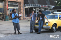 Hayden Christensen and Adrien Brody prepare for a take on set of American Heist.