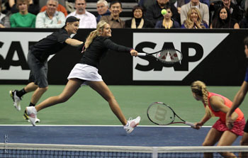 Hayden Christensen still holding hands with Aleksandra for the point after in mixed doubles match November 17, 2011 tennis.