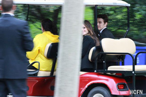 Hayden Christensen and Rachel Bilson are transported by gold cart to a wedding party for George Lucas and Mellody Hobson at Chicago's Promontory Point.