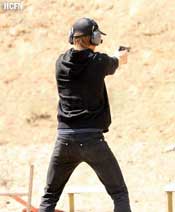 Hayden on the firing range for target practice with Beretta handgun
