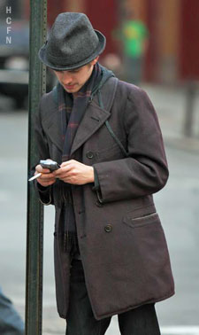 Hayden Christensen, pea coat, hat and scarf on the set of New York, I Love You.