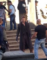 Hayden Christensen readies his broadsword with instruction from a stunt coordinator on the set of Outcast.