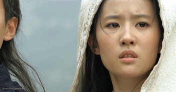 Liu Yifei plays a princess in peril with Hayden Christensen as a knight and her protector in Outcast.