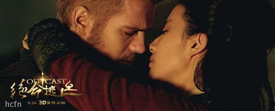 Hayden Christensen and Liu Yifei kiss in a scene from Outcast.